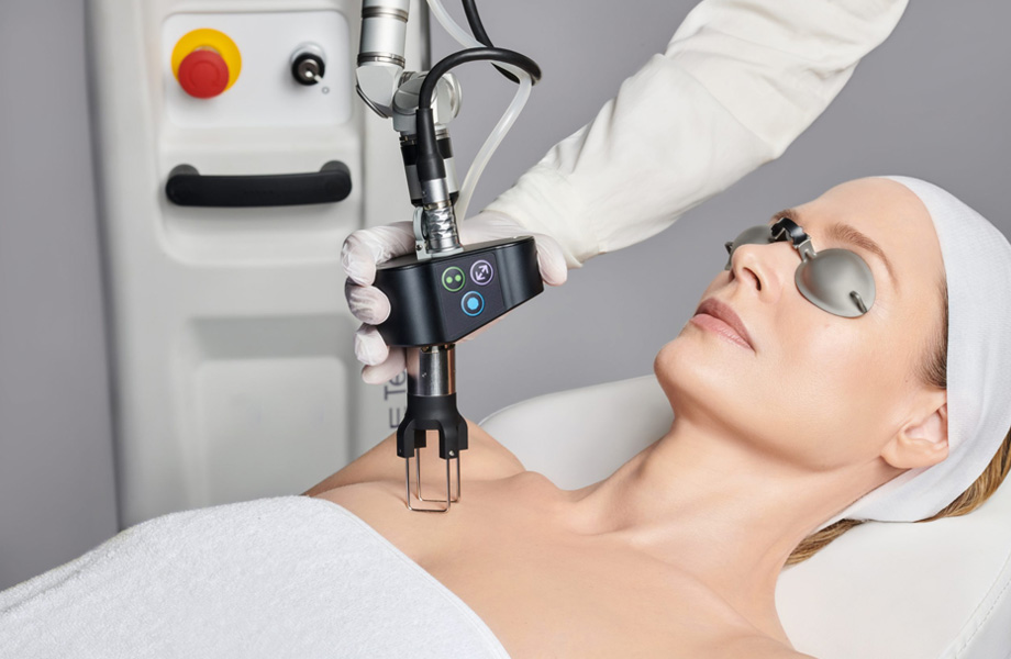 Woman receiving a laser treatment at Avesta Aesthetics Med Spa, showcasing advanced aesthetic technology for skin rejuvenation.
